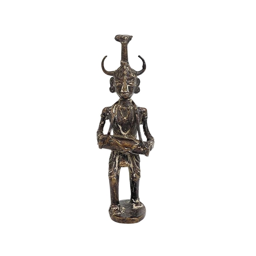 53 - An Indian cast bronze figure of a musician. Dhokra, West Bengal, the figure with a horned headpiece,... 