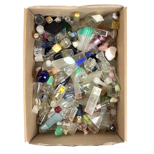 6 - A large collection of miniature scent bottles. In excess of 100 bottles.