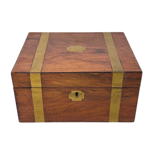 63 - A 19th century walnut and brass bound writing box. Height 13cm width 26cm depth 21cm.