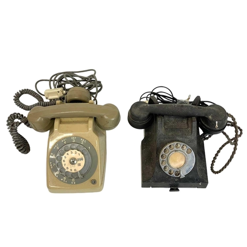 67 - A mid century bakelite telephone. Together with another telephone. (2)