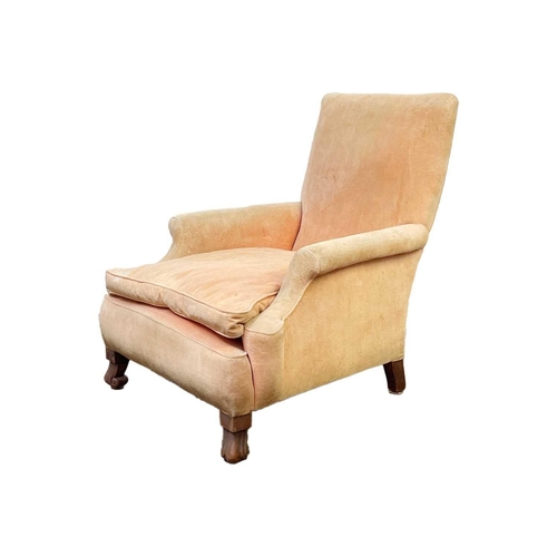 705 - A salmon pink velvet upholstered armchair. 20th century, raised on mahogany scroll front feet, heigh... 