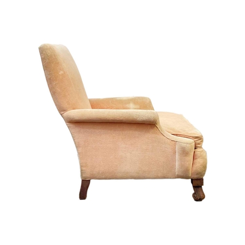 705 - A salmon pink velvet upholstered armchair. 20th century, raised on mahogany scroll front feet, heigh... 