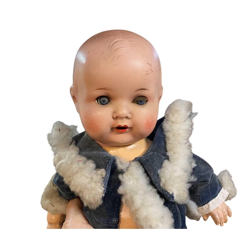 71 - A German Armand Marseille large porcelain head doll. Mould number 390, and marked A 14 M with a disj... 