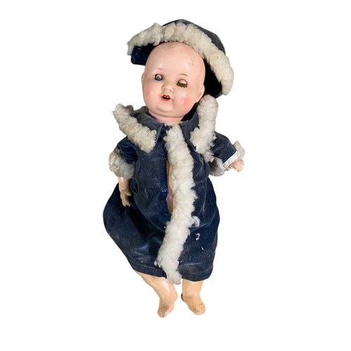 71 - A German Armand Marseille large porcelain head doll. Mould number 390, and marked A 14 M with a disj... 