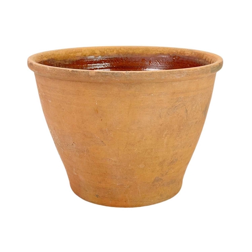 78 - A large terracotta crock pot and wood cover. The interior with umber glaze, diameter 40cm.