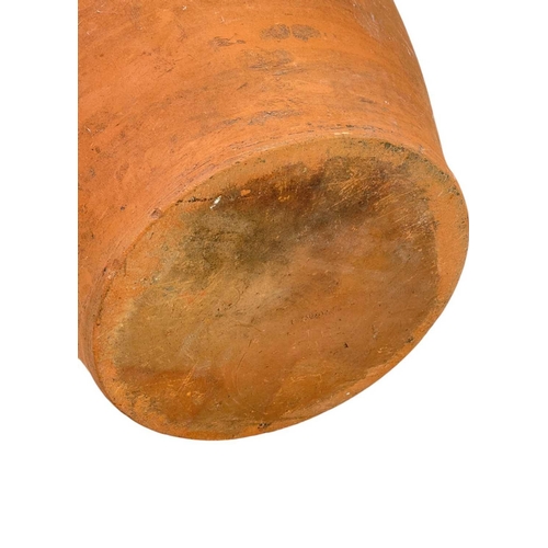 78 - A large terracotta crock pot and wood cover. The interior with umber glaze, diameter 40cm.