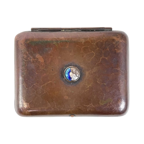 80 - A Newlyn copper and enamel cigarette case. With a planished finish and central blue enamel boss, sta... 