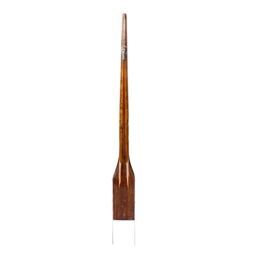 81 - A laminated ash and mahogany yacht tiller. With a stainless steel yoke, length 164cm.