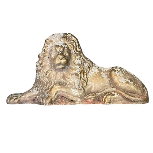 87 - A pair of reconstituted stone lion and unicorn figures. 20th century, with a worn gilded finish, len... 