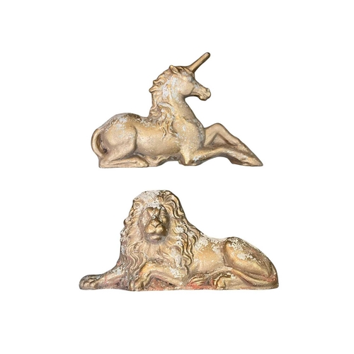 87 - A pair of reconstituted stone lion and unicorn figures. 20th century, with a worn gilded finish, len... 