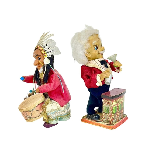 88 - Two Japanese tinplate and celluloid automaton. 'Bartender' and Native American drummer, the latter m... 