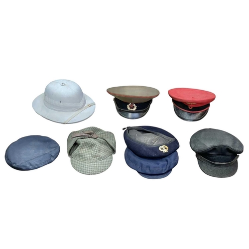 89 - A Trunk of various military and other headwear. Comprising two boaters, two pith helmets, a US balli... 