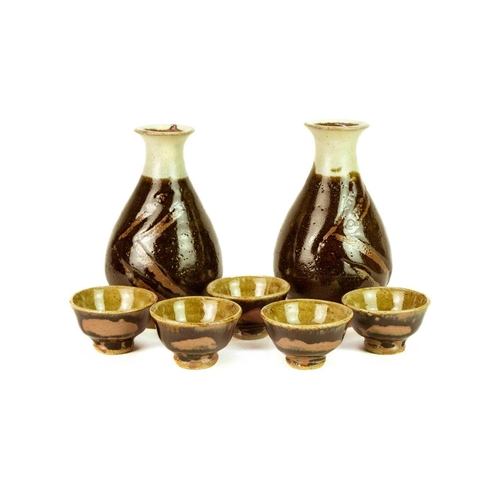 1061 - § Shoji HAMADA (1894-1978) Sake Set Stoneware, comprising of two sake bottles, height 14cm, and five... 