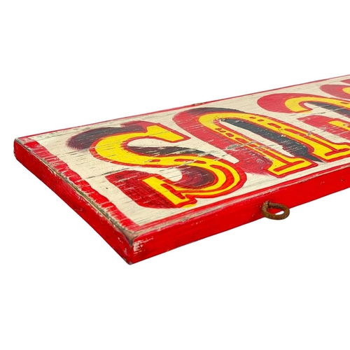 129 - A handpainted 'Circus' sign. On a wooden plank, length 65cm, width 20cm, depth 2cm.