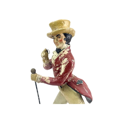 132 - A Johnny Walker advertisement figure. Composition on a painted beech base, height 39cm.