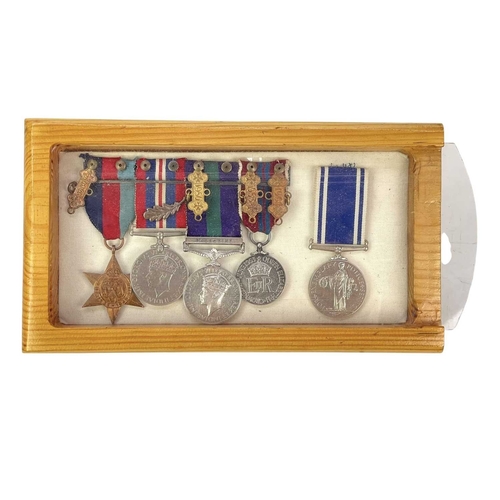 134 - A group of five medals awarded to Garfield Arthur Slade. 1939-1945 Star 1939-1945 War medal with oak... 