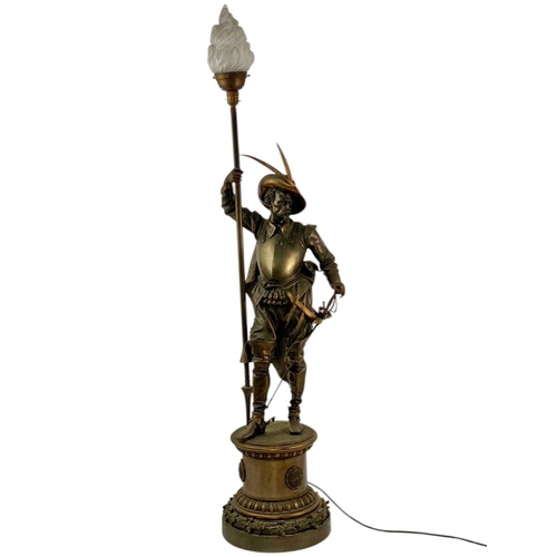 18 - A substantial bronze cavalier floor lamp. French, circa 1910, the lamp with an opaque flame glass sh... 