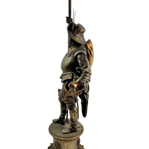 18 - A substantial bronze cavalier floor lamp. French, circa 1910, the lamp with an opaque flame glass sh... 