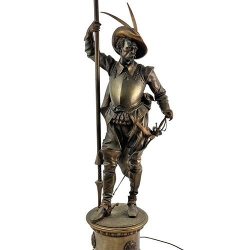 18 - A substantial bronze cavalier floor lamp. French, circa 1910, the lamp with an opaque flame glass sh... 