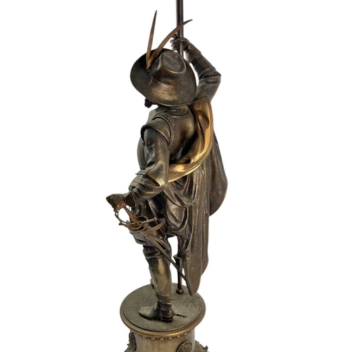 18 - A substantial bronze cavalier floor lamp. French, circa 1910, the lamp with an opaque flame glass sh... 