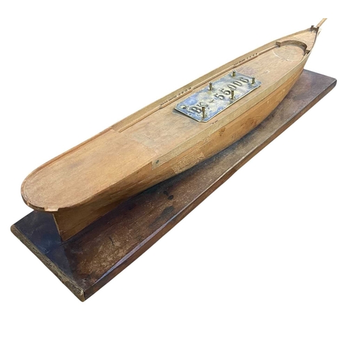 180 - A Builder's full hull model, probably of a schooner. Circa 1850, with laminated sections, mounted a ... 