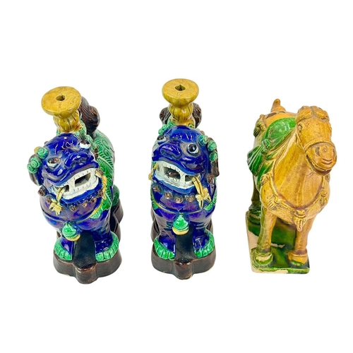 183 - A pair of Chinese glazed Dogs of Fo incense holders. Early to mid 20th century, height 17cm together... 