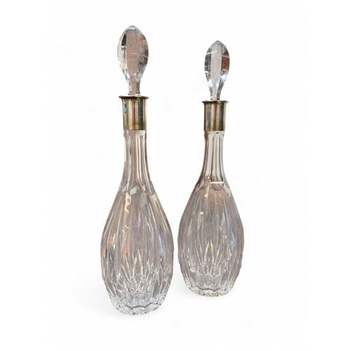 188 - A pair of German white metal mounted lead crystal decanters and stoppers. Circa 1970, the collars wi... 