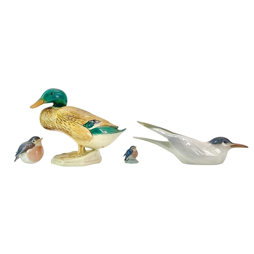 189 - A Beswick figure of a mallard duck. Number 817, height 18cm, together with three Copenhagen birds, T... 