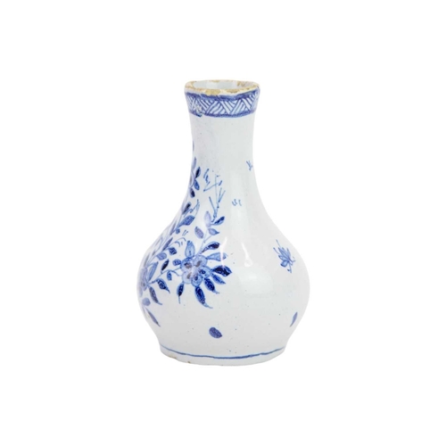 194 - A miniature 18th century Delft vase. Well painted in blue with a floral and pharmaceutical design in... 