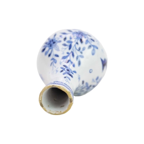 194 - A miniature 18th century Delft vase. Well painted in blue with a floral and pharmaceutical design in... 