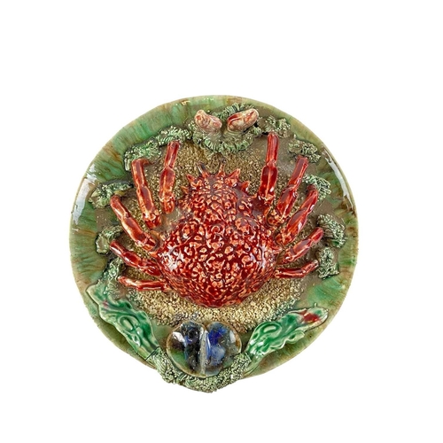 196 - Three Palissy Ware type circular wall plates. One larger example featuring a crab and clam shells (2... 