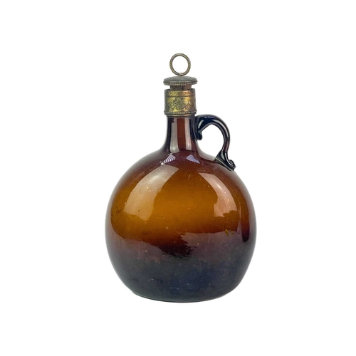 204 - A Victorian brown glass carafe and decanter. The carafe features an etched brass stopper and mount, ... 