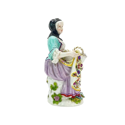 206 - An Helena Wolfsohn 'bouquetiere' figure. 19th century, after the Meissen original, modelled as a sea... 