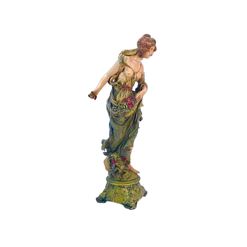 209 - An Ernst Wahliss Austrian Art Nouveau painted terracotta figure. Of a maiden, in flowing robes with ... 