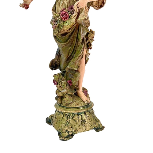 209 - An Ernst Wahliss Austrian Art Nouveau painted terracotta figure. Of a maiden, in flowing robes with ... 