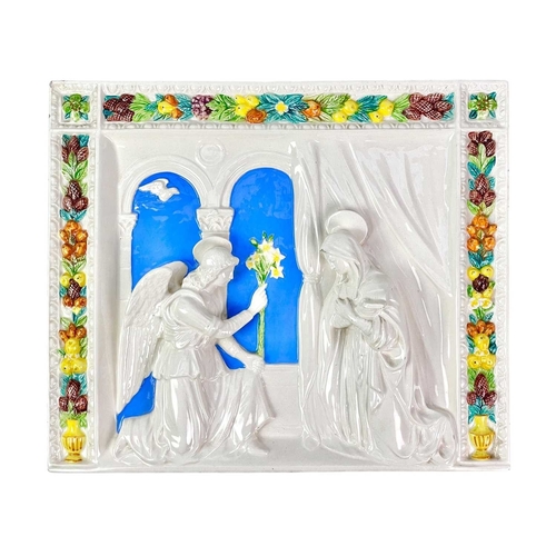 211 - After Della Robbia, A pottery wall plaque. Possibly Cantigalli, circa 1900, moulded in relief with a... 