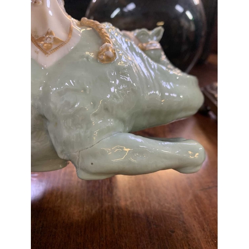 221 - A Royal Worcester porcelain camel modelled by James Hadley. Incised signature and impressed marks, h... 