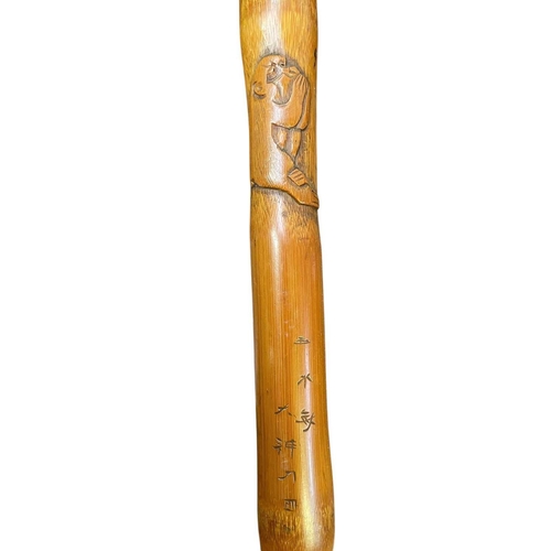 23 - A carved bamboo cane. Decorated with the three wise monkeys, see no evil, hear no evil, speak no evi... 