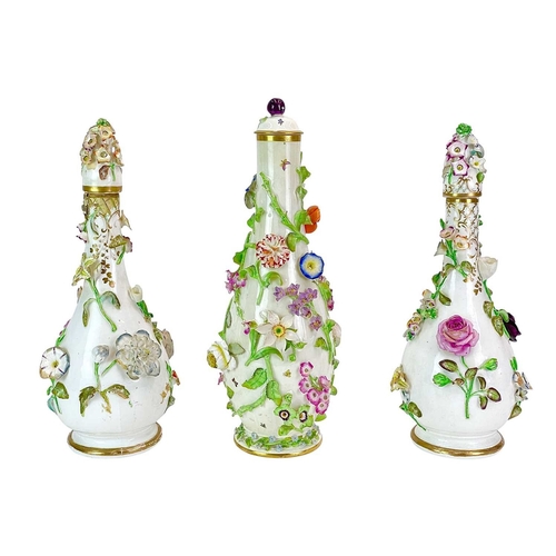 233 - A pair of English porcelain floral encrusted vases. Circa 1850, with wide scrolling rims, height 12c... 