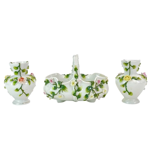 233 - A pair of English porcelain floral encrusted vases. Circa 1850, with wide scrolling rims, height 12c... 