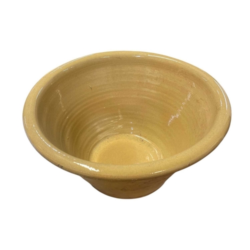 240 - A stoneware dairy bowl. Glazed interior and rim, diameter 44cm.