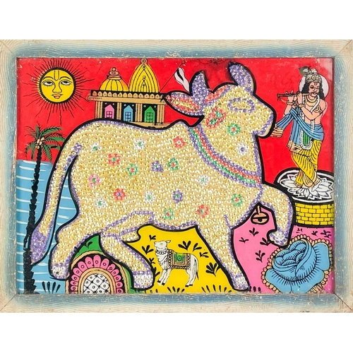 244 - An Indian Sacred Cow picture. A sequinned cow, surrounded by a colourful scene painted onto glass fe... 