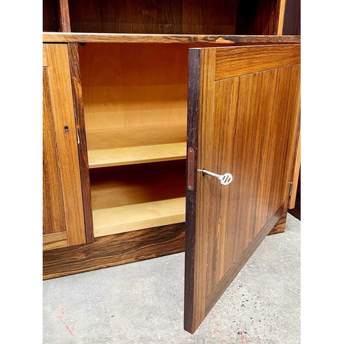 247 - A pair of Danish side cabinets/units. Mid-Century, in Indian rosewood possibly by Paul Hundevad, wit... 