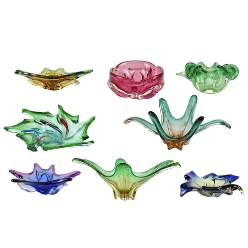 264 - Eight colourful art glass dishes of organic form. Mid 20th century, Italian and Czechoslovakian, the... 