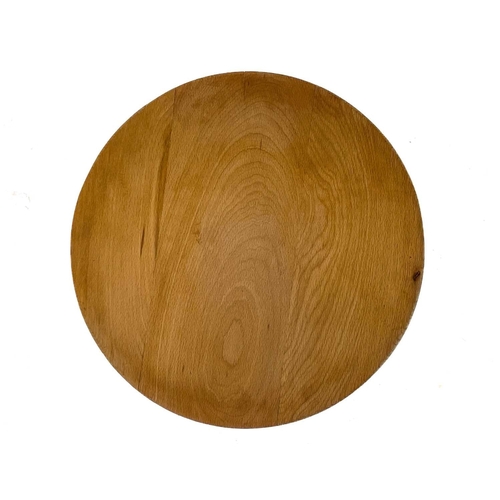 266 - A mid century circular beech coffee or occasional table. With a slightly dished top, on three turned... 