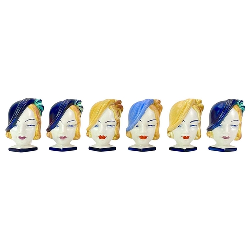 267 - Six Beswick Art Deco mask head ceramic napkin rings. Each handpainted, height 8cm.