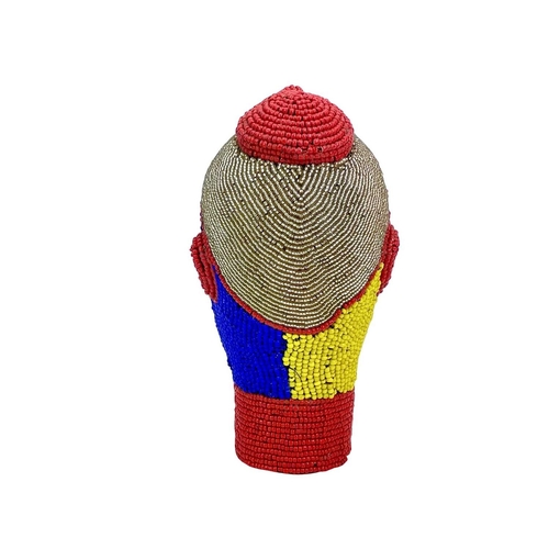 269 - An African beaded head ornament. Formed of terracotta with colourful glass bead overlay in red, blue... 