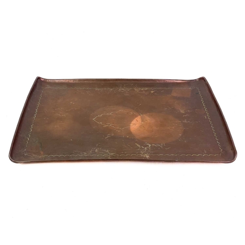 27 - Two Newlyn copper rectangular trays Each with a central cartouche, stamped Newlyn, the smaller of wh... 