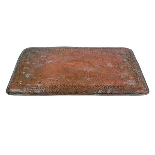 27 - Two Newlyn copper rectangular trays Each with a central cartouche, stamped Newlyn, the smaller of wh... 