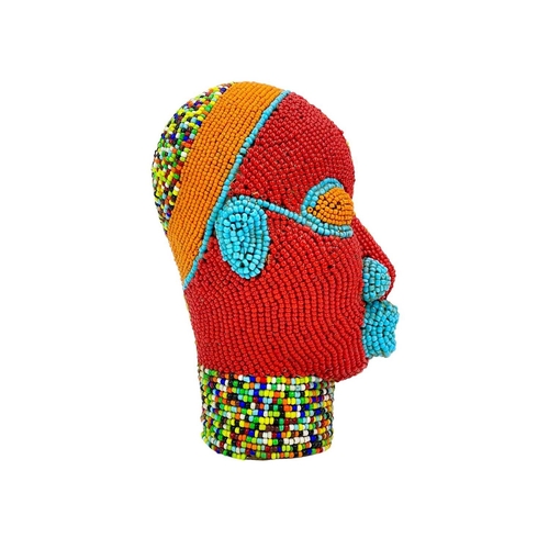 272 - An African beaded head ornament. Formed of terracotta, with multicoloured glass bead overlay, height... 